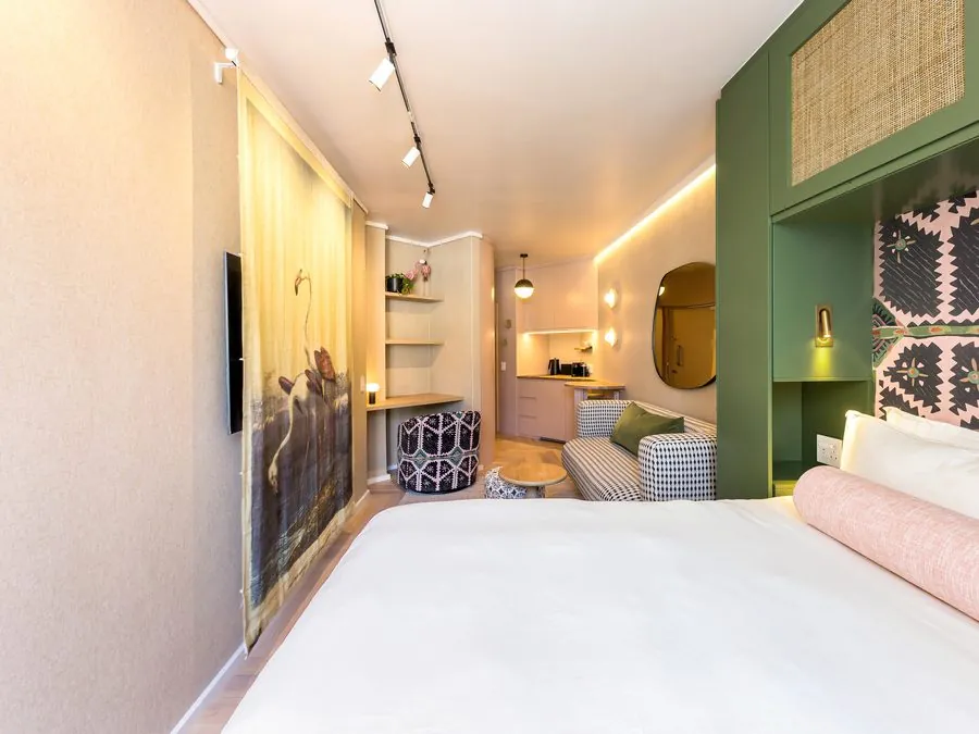 The bed and the artwork wall